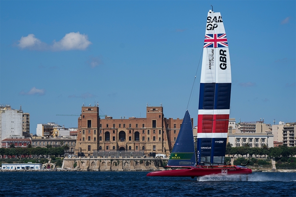 Great Britain SailGP Team driven by interim skipper Paul Goodison sail past the Taranto Palazzo del Governo during a practice session ahead of Italy SailGP, Event 2, Season 2 in Taranto, Italy. 01 June 2021. Photo: Bob Martin for SailGP.